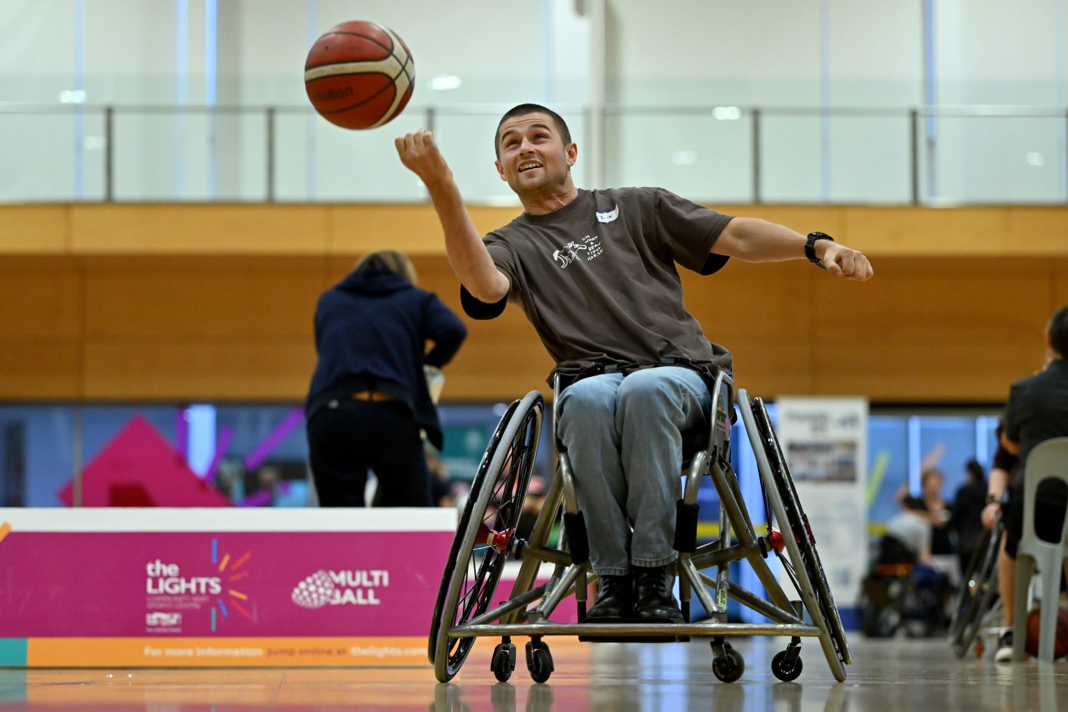 A man trying out wheelchair basketball